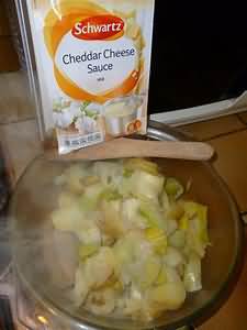 Cheese sauce, packet mix, made up with skimmed milk, homemade