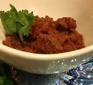 Curry, beef, retail, reheated, with rice