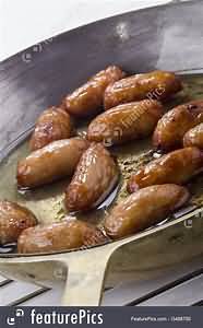 Sausages, pork, frozen, fried in vegetable oil