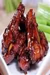 Chicken wings, marinated, meat and skin, barbecued