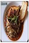 Coq au vin, homemade, weighed with bone