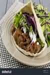 Shish kebab in pitta bread with salad