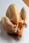 Poussin, raw, meat and skin